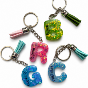 Llavero Glitter -pigmento inicial con borla